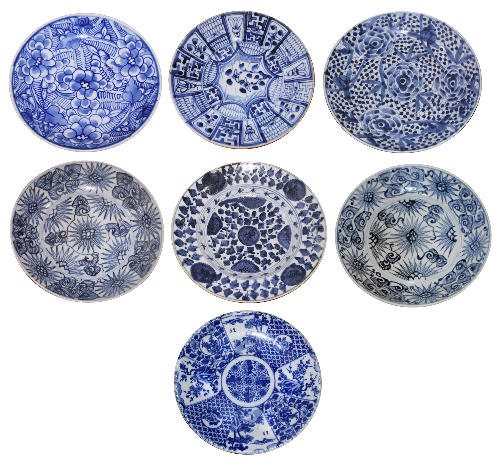 A set of seven ceramic consisting of six pieces Chinese blue and white floral plates and a Japanese blue and white printed floral plate